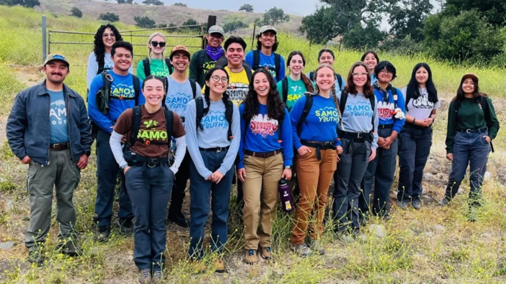 Group of diverse youth stand together outside